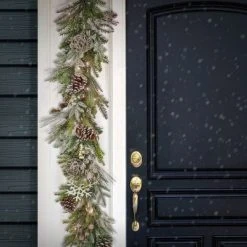 HGTV Home Collection 9ft Pre Lit Artificial Christmas Garland, Mixed Branch Tips , Decorated with Pinecones, Berries, Snowflakes, and Ornaments