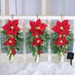 Collections Etc. Collections Etc Solar Powered Evergreen Poinsettia Swag Hangers - Set of 3 9 X 5 X 19