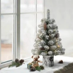 2ft Puleo Pre-Lit Flocked Tabletop Artificial Christmas Tree with Pine Cones in Metal Pot