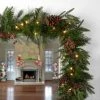 National Tree Company Pre-Lit 'Feel Real' Artificial Christmas Garland, Green, Colonial Fir, White Lights, With Pine Cones, Plug In, 9 Feet
