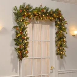 National Tree Company Pre-Lit Artificial Christmas Garland, Green, Wintry Pine, White Lights, with Pine Cones, Berry Clusters, Plug In,9 Feet