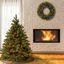 National Tree Company 4.5 ft Pre-Lit 'Feel Real' Artificial Full Downswept Christmas Tree, Green, Douglas Fir, Multicolor Lights, Includes Standt